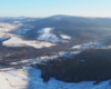 Miejscowości Rzepedź i Turzańsk widziane podczas lotu paralotnią zimą przez przedstawiciela Biura Podróży Bieszczader.