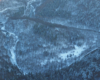 Lasy Nadleśnictwa Komańcza podziwiane podczas lotu paralotnią nad Bieszczadami - w tym wypadku ziemią Gminy Komańcza.
